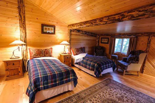 Elegant cabin interior — warm wood, river view